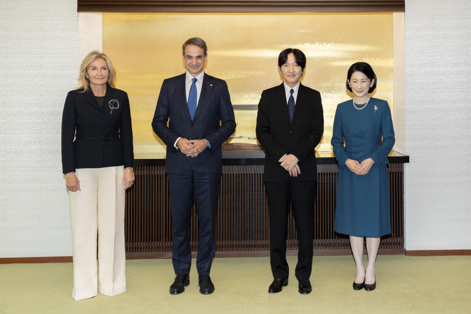 In this photo provided by the Imperial Household Agency of Japan, Japan's Crown Prince Akishino, center right, and Crown Princess Kiko, right, meet Greek Prime Minister Kyriakos Mitsotakis with his wife Mareva Grabowski during a meeting at the Imperial Palace in Tokyo Monday, Jan. 30, 2023. (Imperial Household Agency of Japan via AP)