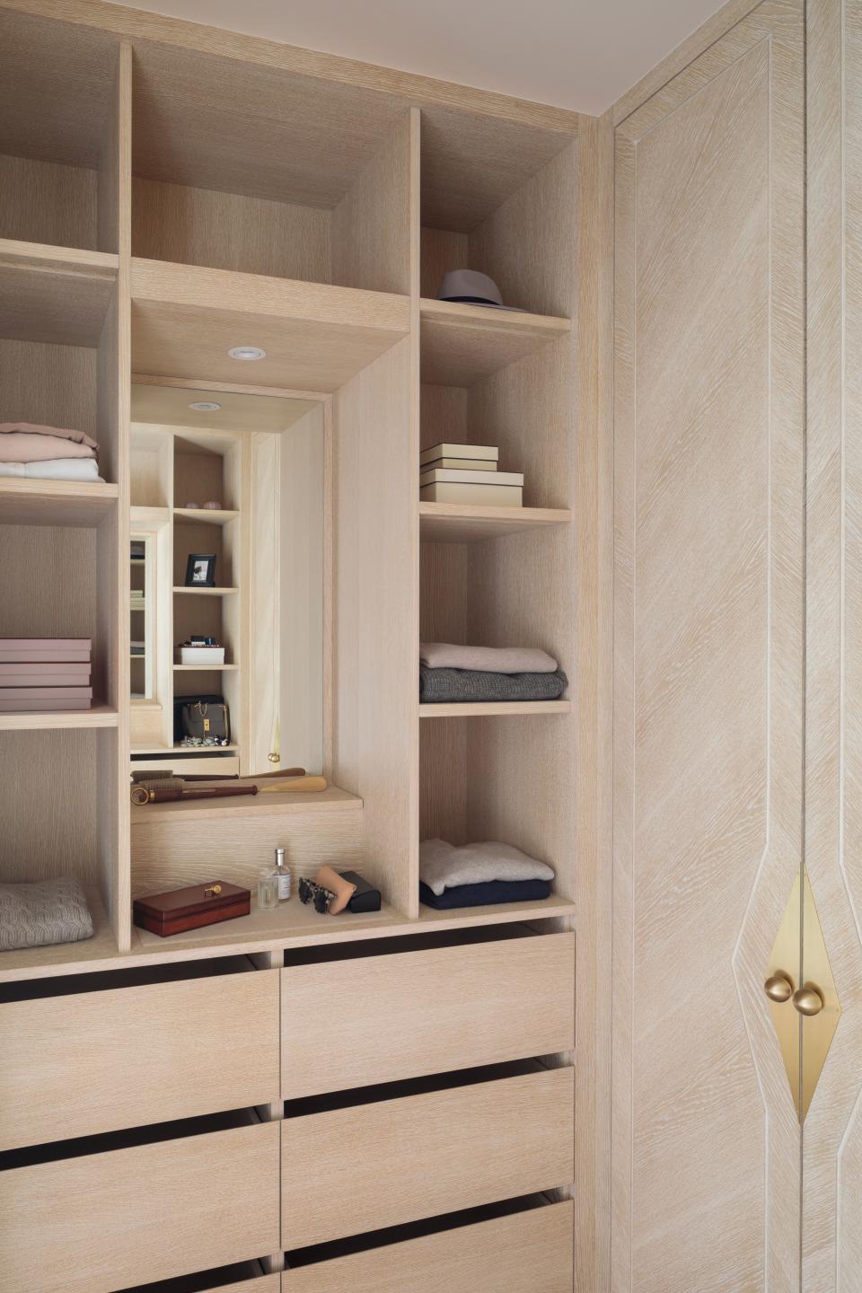 <p> 'We recommend opting for paler colors and finishes within smaller spaces to ensure the room feels bright, whilst increasing the impression of a larger footprint,' says Clara Ewart, head of design at Kitesgrove. 'The open shelving, drawers, and discreet central mirror were also incorporated into the cabinetry to further the feeling of space whilst creating a refined but pared-back aesthetic.' </p>