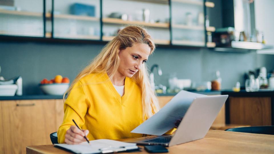 Cute Blonde Freelancer Using Her Living Room As Office.