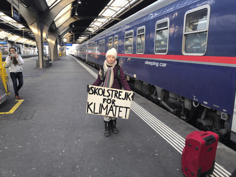 Swedish climate activist Greta Thunberg arrives at the main station in Zurich, Switzerland, Wednesday, Jan. 23, 2019. Thunberg will attend the World Economic Forum WEF from Wednesday to Friday. Because air travel emits a lot of CO2, she decided to travel by train. (Adrian Reusser/Keystone via AP)