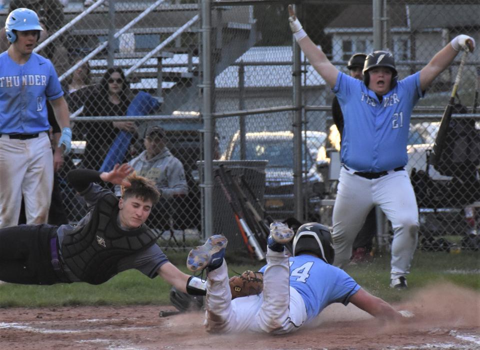 Little Falls catcher Braden McCumber (left) makes a diving attempt to tag Central Valley Academy's Cole Wheet during the second inning of Saturday's game in Ilion. Wheet was safe on the play and the Thunder took a 2-1 lead.