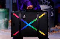 A model presents a bag creation by designer Virgil Abloh during a preview show for his Fall/Winter 2019-2020 collection for fashion house Louis Vuitton during Men's Fashion Week in Paris, France, January 17, 2019. REUTERS/Gonzalo Fuentes