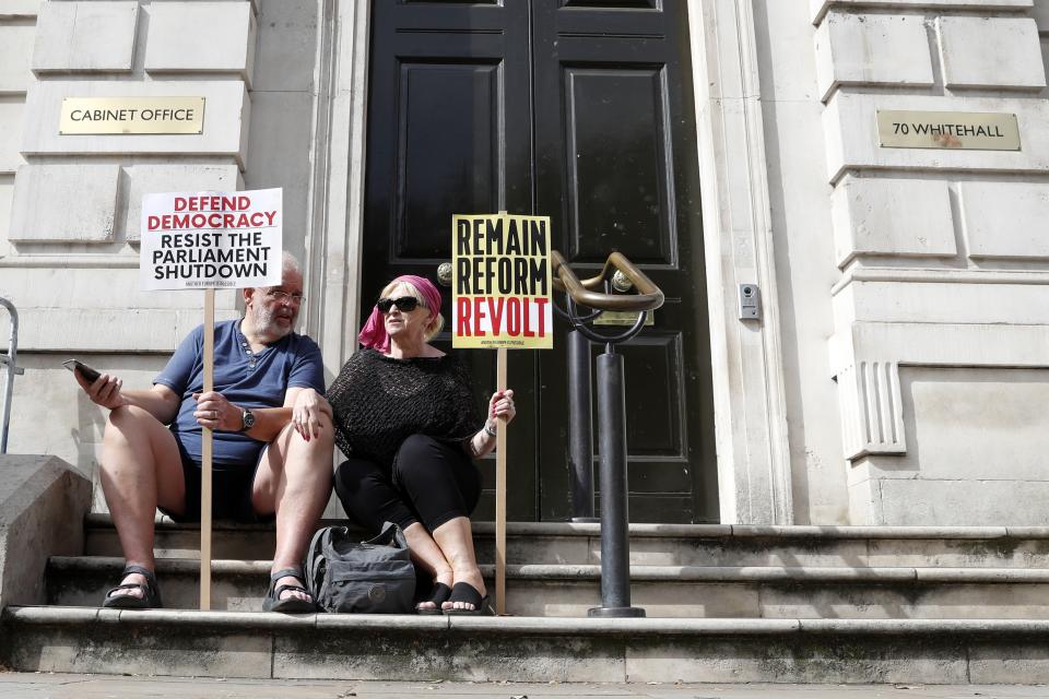 Anti-Brexit protesters from 'Stop the Coup' movement demonstrate near Downing Street in London, Saturday, Aug. 31, 2019. Political opposition to Prime Minister Boris Johnson's move to suspend Parliament is crystalizing, with protests around Britain and a petition to block the move gaining more than 1 million signatures. (AP Photo/Alastair Grant)