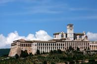 A view of the Basilica of St. Francis in Assisi, Italy. Assisi is a small Umbrian town in central Italy, located 12 miles east of Perugia at an elevation of 1,300 feet . Assisi is best known as the birthplace of St. Francis of Assisi founder of the Franciscan order, and one of the most popular Catholic saints in history.