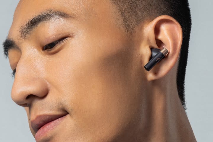 Man wearing 1More PistonBuds Pro Q30.