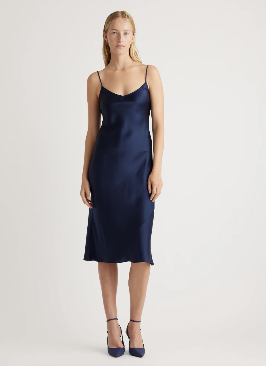 <p><a href="https://go.redirectingat.com?id=74968X1596630&url=https%3A%2F%2Fwww.quince.com%2Fwomen%2Fsilk-slip-dress%3Fcolor%3Dnavy%26gender%3Dwomen%26tracker%3Dcollection_page__women%252Fdresses__Midi%2BDresses__0&sref=https%3A%2F%2Fwww.thepioneerwoman.com%2Ffashion-style%2Fg43231815%2Fspring-wedding-guest-dresses%2F" rel="nofollow noopener" target="_blank" data-ylk="slk:Shop Now;elm:context_link;itc:0;sec:content-canvas" class="link rapid-noclick-resp">Shop Now</a></p><p>100% Washable Silk Slip Dress</p><p>$79.90</p><span class="copyright">Quince</span>