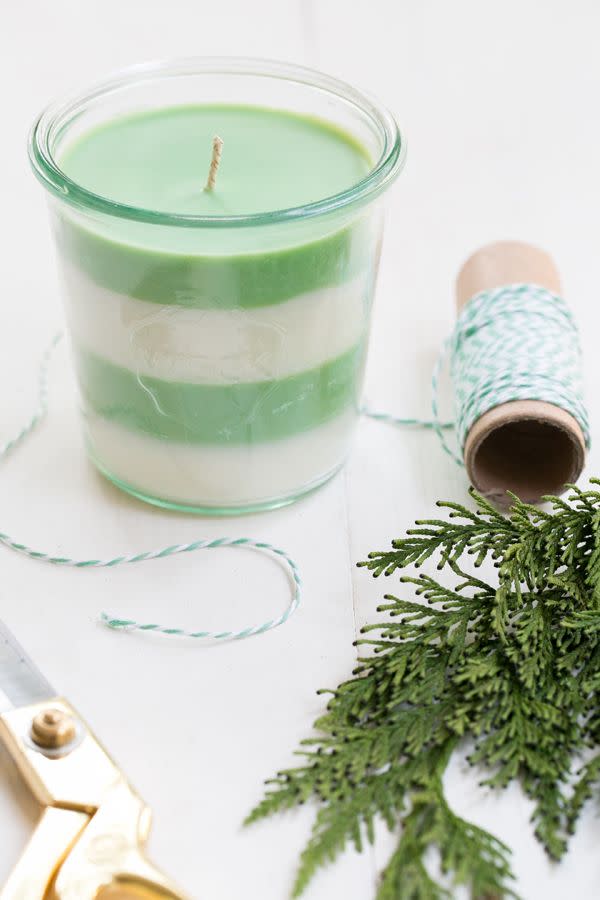 <p>These candles will make your house smell like the Christmas spirit (even if you have an artificial tree). Learn how to make your own from <a href="https://sugarandcharm.com/2014/12/diy-pine-scented-soy-candles.html" rel="nofollow noopener" target="_blank" data-ylk="slk:Sugar and Charm;elm:context_link;itc:0;sec:content-canvas" class="link ">Sugar and Charm</a>.</p>