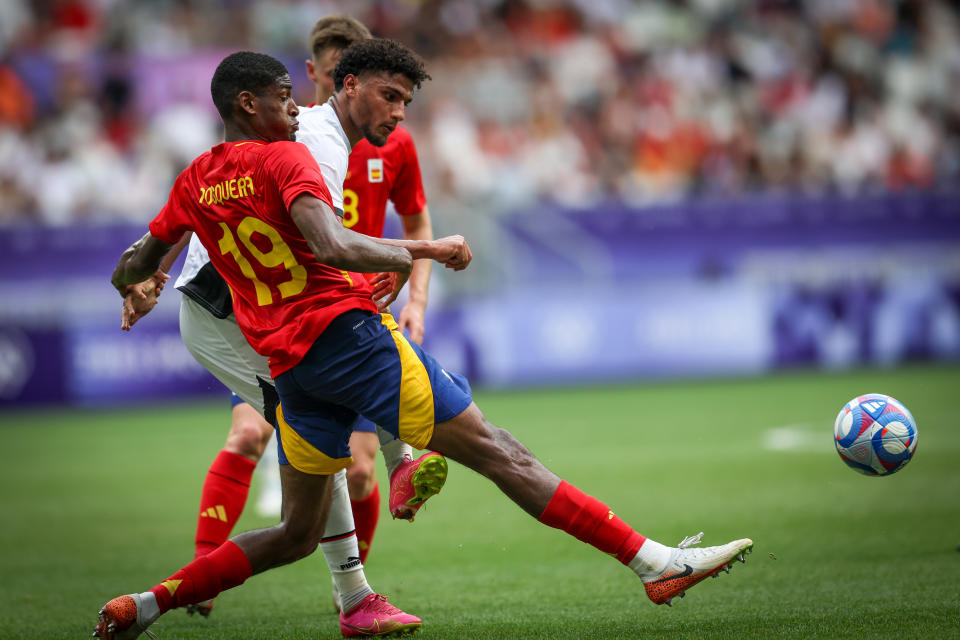 Hossam Abdelmaguid of the Egypt team is battling for possession with Cristian Mosquera of the Spain team during the men's group C football match between Egypt and Spain during the Paris 2024 Olympic Games at Stade de Bordeaux in Bordeaux, France, on July 30, 2024. (Photo by Ayman Aref/NurPhoto via Getty Images)