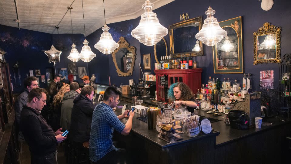 Customers enjoying non-alcoholic beverages at New York's Hekate Cafe and Elixer Lounge. - Michael M. Santiago/Getty Images