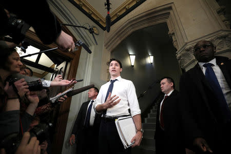 Canada's Prime Minister Justin Trudeau speaks to journalists before the start of a Liberal Party caucus meeting in the West Block on Parliament Hill in Ottawa, Ontario, Canada February 20, 2019. REUTERS/Chris Wattie