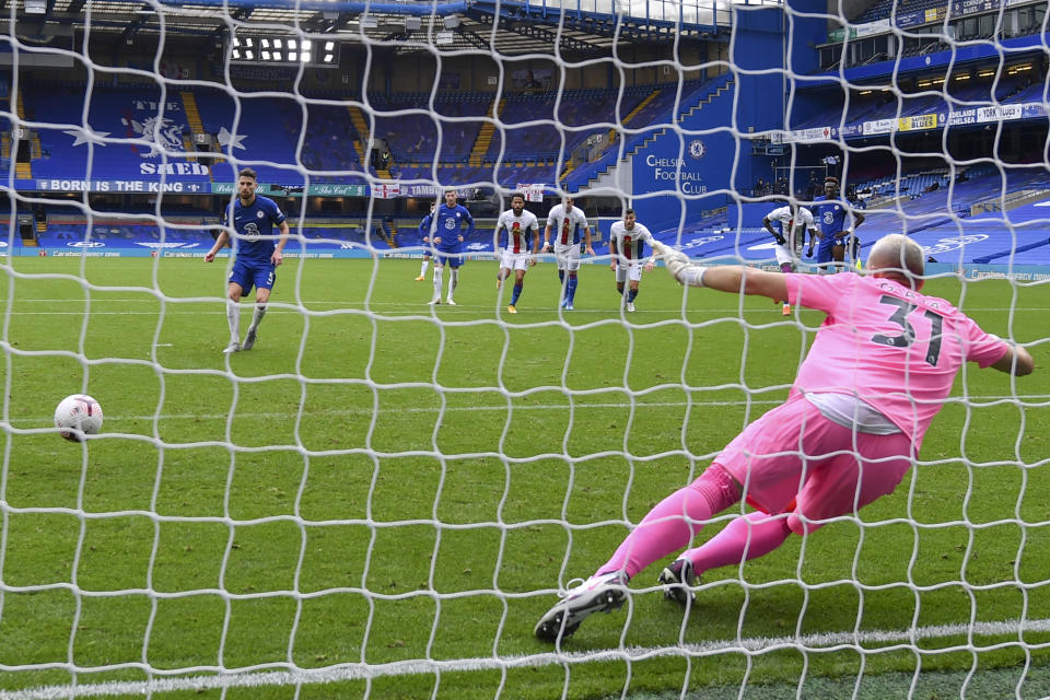 Chelsea's Jorginho, left, scores his side's third goal on a penalty kick during an English Premier League soccer match between Chelsea and Crystal Palace at Stamford Bridge stadium in London, Saturday, Oct. 3, 2020. (Mike Hewitt/ Pool via AP)