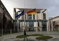 EU and German flags fly at half-mast for the victims of a shooting in Hanau, in Berlin