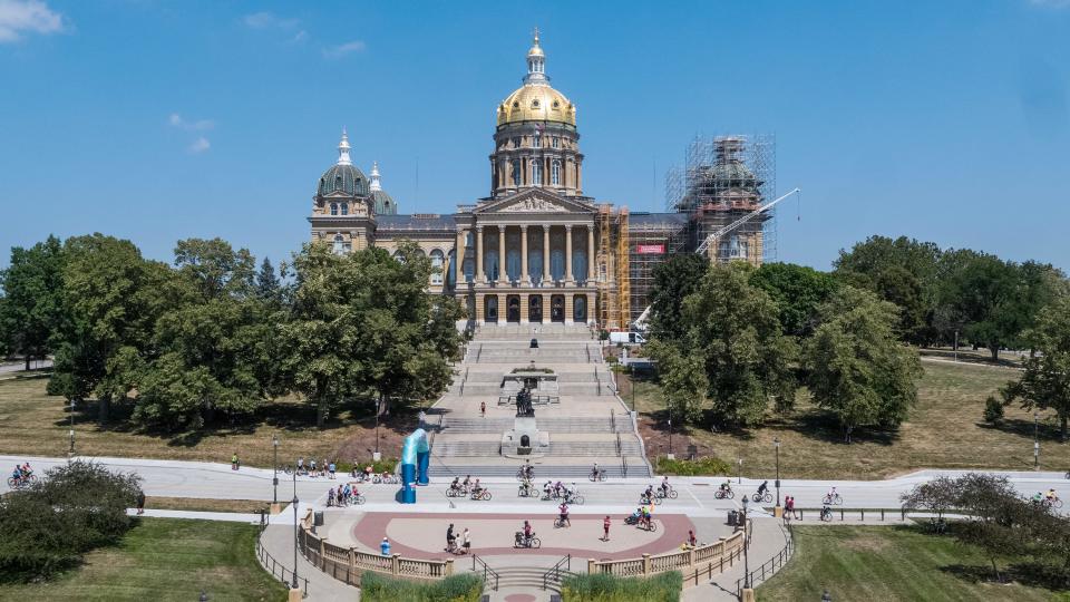 Bikers pass the steps of the Iowa State Capitol as they ride into Downtown Des Moines on day four of the 50th ride of RAGBRAI, on Wednesday, July 26, 2023.