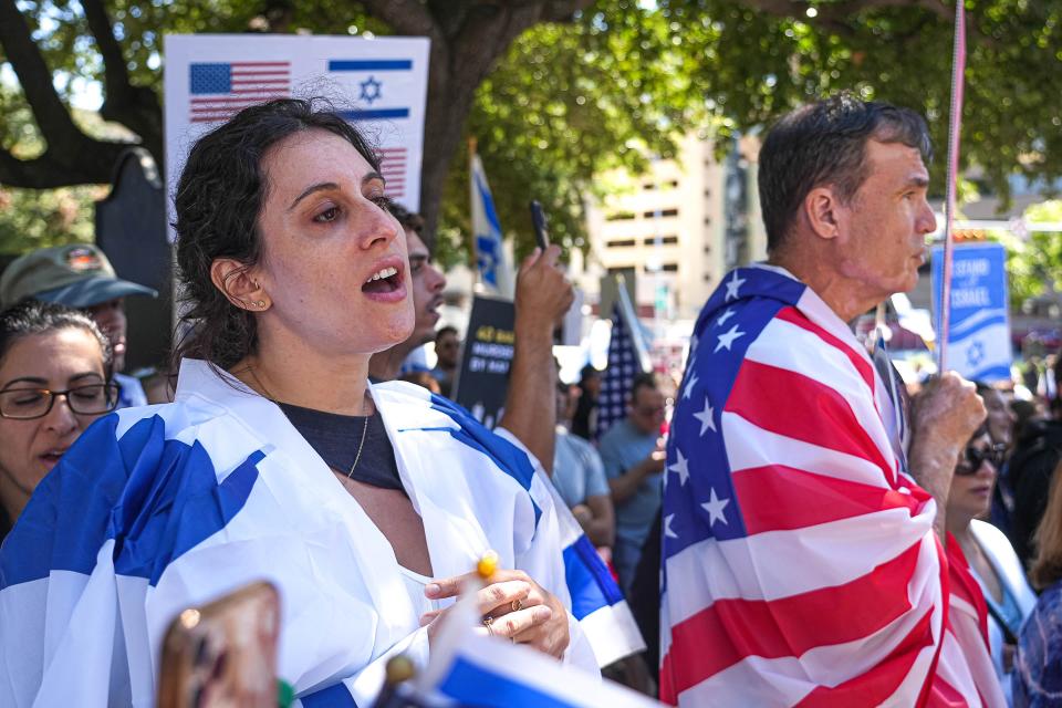 Co-organizer Toba Hellerstein sings at a solidarity rally for Israel outside the Texas Capitol on Sunday, Oct. 15, 2023. "This is a peaceful rally to condemn the atrocities of Hamas. We're here to demand that the terrorism stops and that all the hostages are released," Hellerstein said.