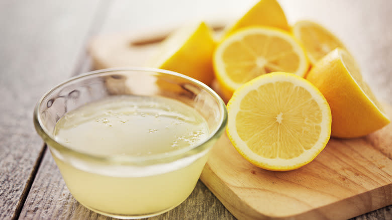 halved lemons with lemon juice
