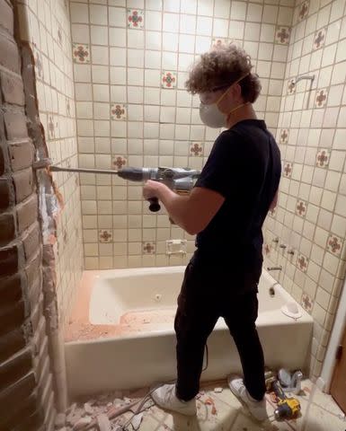 <p>Credit: Ant Anstead/Instagram</p> Ant Anstead shares video of son Archie drilling a bathroom wall.