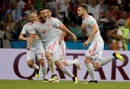 Soccer Football - World Cup - Group B - Portugal vs Spain - Fisht Stadium, Sochi, Russia - June 15, 2018 Spain's Nacho celebrates with team mates after scoring their third goal REUTERS/Carlos Barria