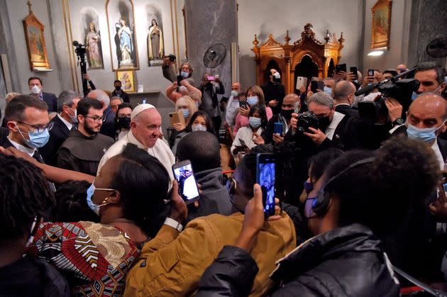 Pope Francis greets attendees after an ecumenical prayer with migrants at the Roman Catholic church of the Holy Cross near the United Nations buffer zone in the Cypriot city of Nicosia, Europe's last divided capital, on December 3, 2021. - Pope Francis appealed for a 