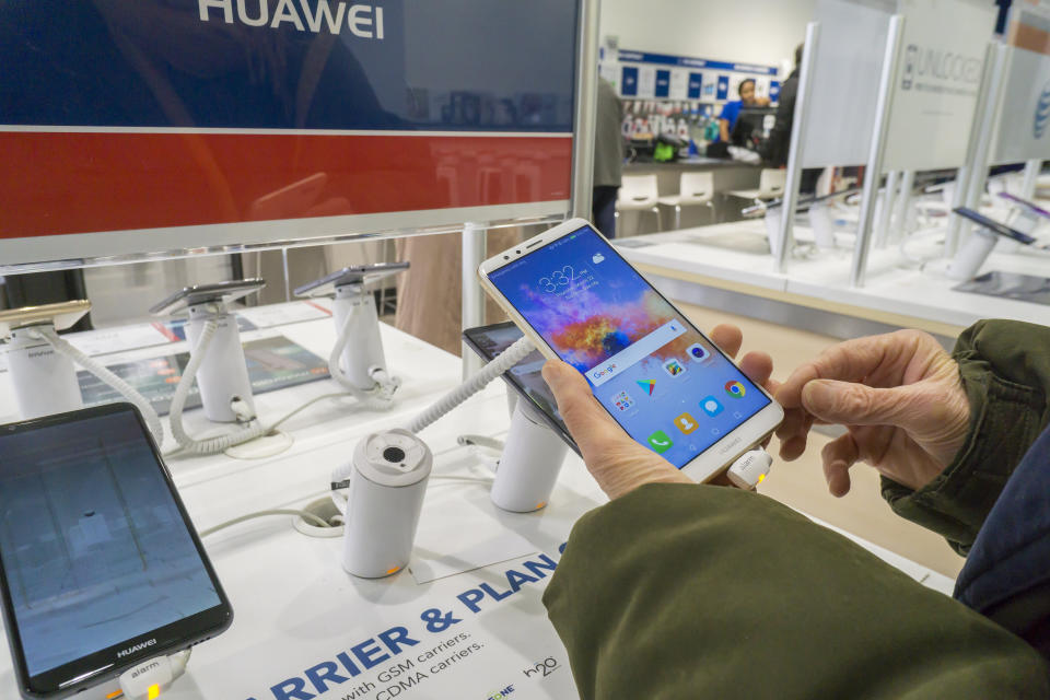 A consumer tries out an Huawei brand, Chinese manufactured, smartphone in a Best Buy store in New York on Thursday, March 22, 2018. Best Buy is reported to be cutting relations with Huawei Technologies citing scrutiny of Chinese tech firms selling products in the U.S. There are allegations of spying and its close ties to the Chinese military and intellectual property theft regarding Huawei. (�Photo by Richard B. Levine)