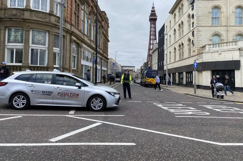 Police stand guard during Wednesday's protest