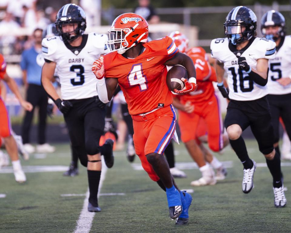 Orange's Jakivion Calip carries the ball against Hilliard Darby on Aug. 19.