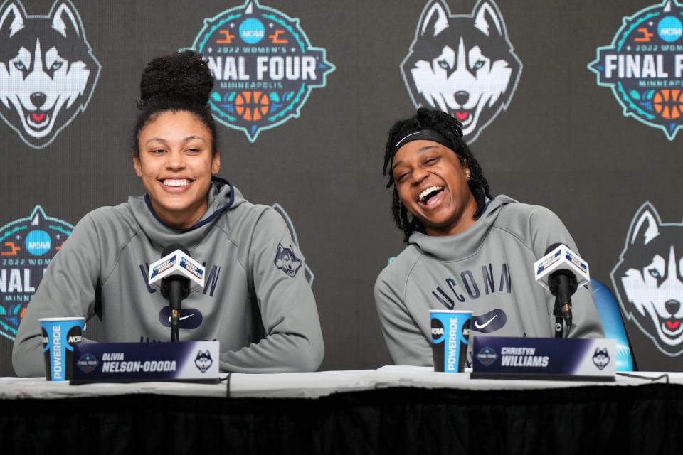 Huskies forward Olivia Nelson-Ododa (left) and guard Christyn Williams share a laugh during a news conference at Target Center.