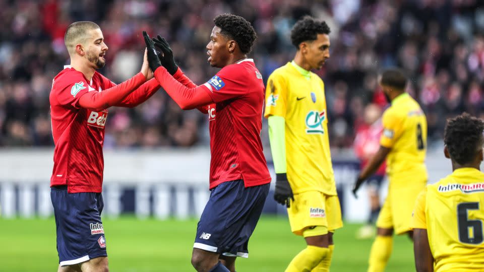 Jonathan David (right) celebrates one of his goals with fellow hat-trick hero Edon Zhegrova. - Johnny Fidelin/Icon Sport/Getty Images