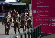 LONDON, ENGLAND - JULY 26: Members of the British army patrol the grounds during the practice session ahead of the London 2012 Olympic Games at the All England Lawn Tennis and Croquet Club in Wimbledon on July 26, 2012 in London, England. (Photo by Clive Brunskill/Getty Images)