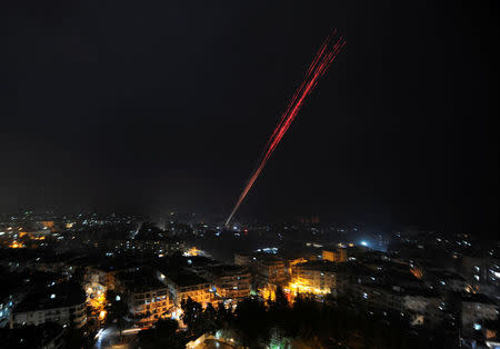 Govermental Syrian forces fire into sky as celebrating their victory against rebels in eastern Aleppo, Syria December 12,2016. REUTERS/ Omar Sanadiki