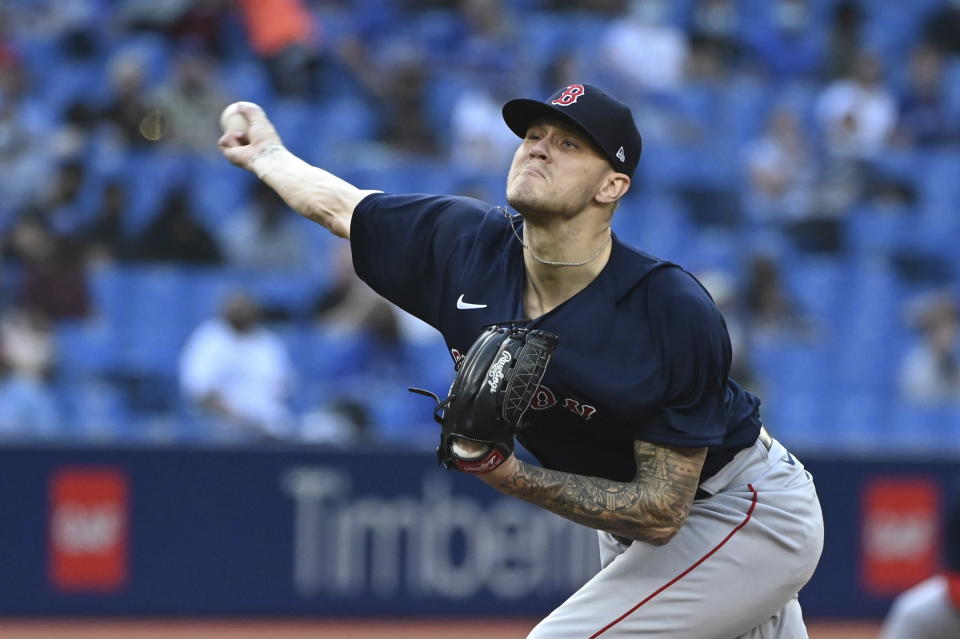 Boston Red Sox starting pitcher Tanner Houck throws in the first inning of the second game of a baseball doubleheader against the Toronto Blue Jays in Toronto, Saturday Aug. 7, 2021. (Jon Blacker/The Canadian Press via AP)