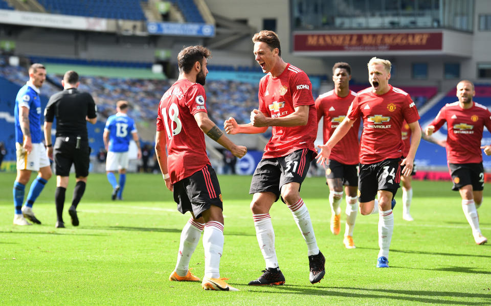 Bruno Fernandes (18) celebrates with Manchester United teammates after scoring his side's winner against Brighton & Hove Albion. (Glyn Kirk/Getty Images)