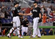 Jul 14, 2018; Miami, FL, USA; Miami Marlins catcher J.T. Realmuto (left) greets Marlins relief pitcher Kyle Barraclough (right) after the Marlins defeated the Philadelphia Phillies at Marlins Park. Mandatory Credit: Steve Mitchell-USA TODAY Sports