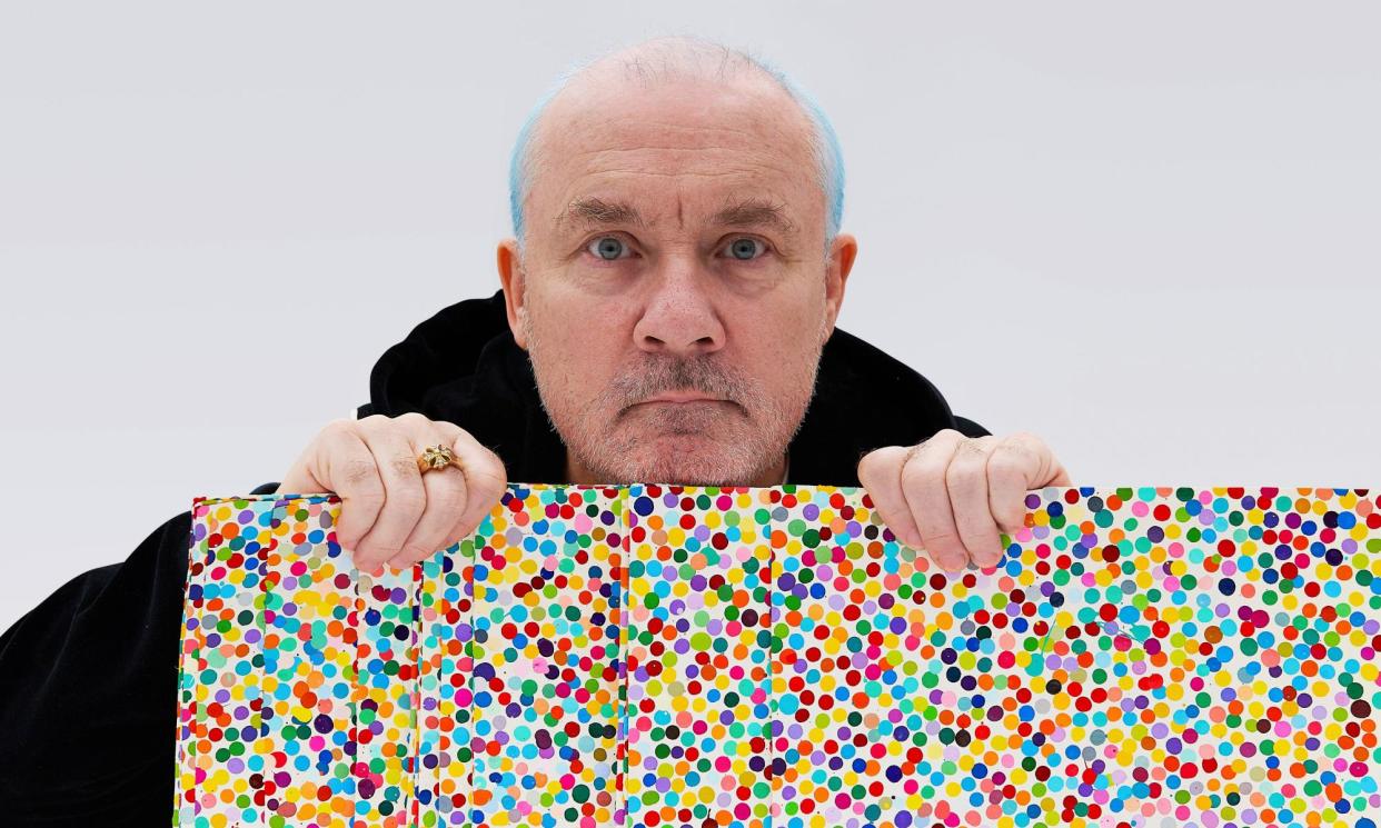 <span>Damien Hirst with a painting from The Currency collection.</span><span>Photograph: Amer Ghazzal/Alamy</span>
