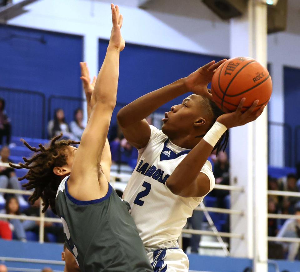 Randolph's Isaiah Michel shoots at the basket over Southeastern defender Adriano Xavier during a game on Friday, Feb. 17, 2023.   