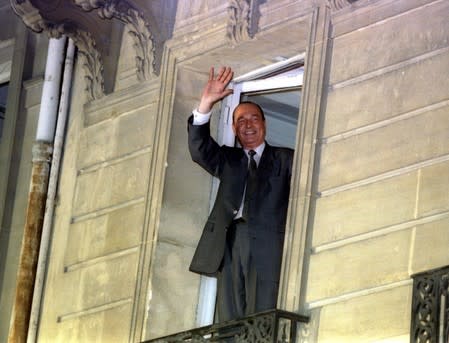 FILE PHOTO: Newly elected French president Jacques Chirac waves from the balcony of his campaign headquarters in Paris