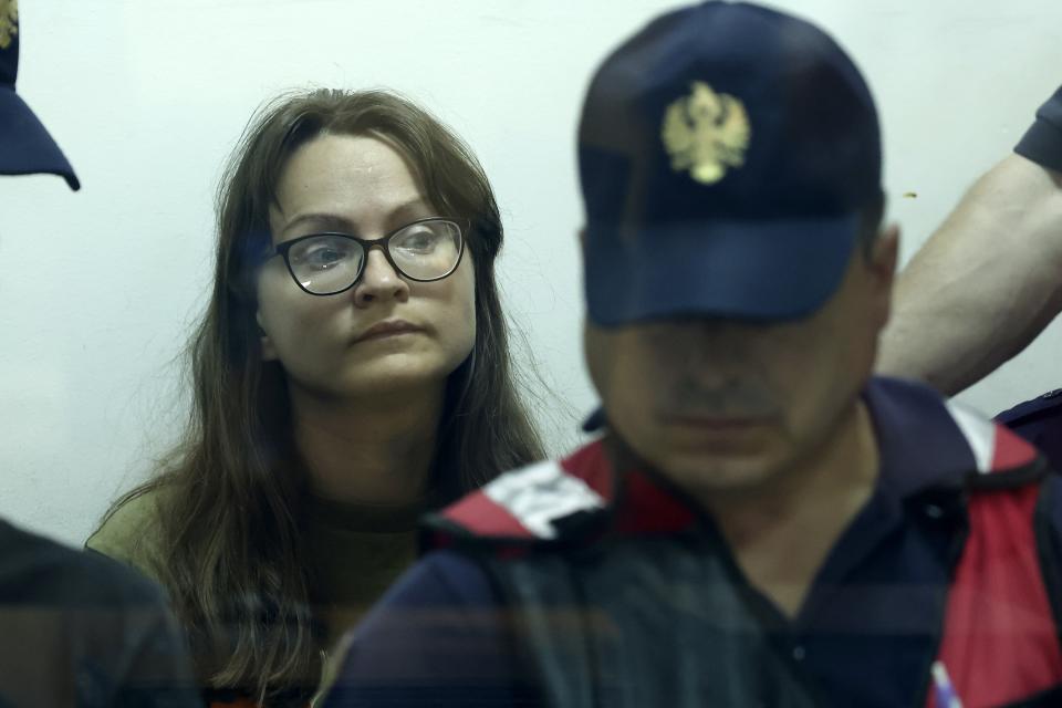 Russian Svetlana Timofeeva, guarded by police appears at a court in Elbasan, Albania, Wednesday, Aug. 24, 2022. Two Russians and a Ukrainian were arrested for alleged espionage at a military plant in southern Albania, on Saturday, Aug. 20. Two military guards were injured by a "neo-paralyzing spray" used by the Russian while resisting arrest according to the Albanian Defence Ministry. (AP Photo/Franc Zhurda)