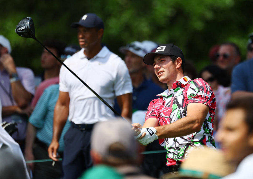 Golf - The Masters - Augusta National Golf Club - Augusta, Georgia, U.S. - April 6, 2023 Norway's Viktor Hovland hits his tee shot on the 9th hole during the first round as Tiger Woods of the U.S. looks on REUTERS/Mike Segar