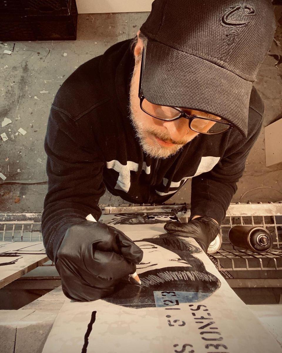 Jackson Township-based artist Billy Ludwig, shown working in his studio, will open his "Skull & Bones" solo show on Friday at Cyrus Custom Framing & Art Gallery in Canton.