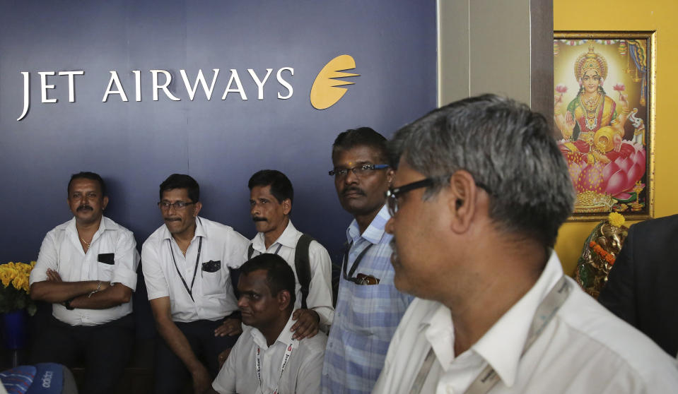 Employees of Jet Airways gather to demand clarification on unpaid salaries at the company headquarters in Mumbai, India Thursday, April 18, 2019. Jet Airways, once India's largest airline, announced on Wednesday that it is suspending all operations after failing to raise enough money to run its services. (AP Photo/Rafiq Maqbool)