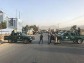 REFILE - QUALITY REPEAT Afghan policemen stand guard at the site of a blast in Kabul, Afghanistan September 13, 2017. REUTERS/Mohammad Ismail