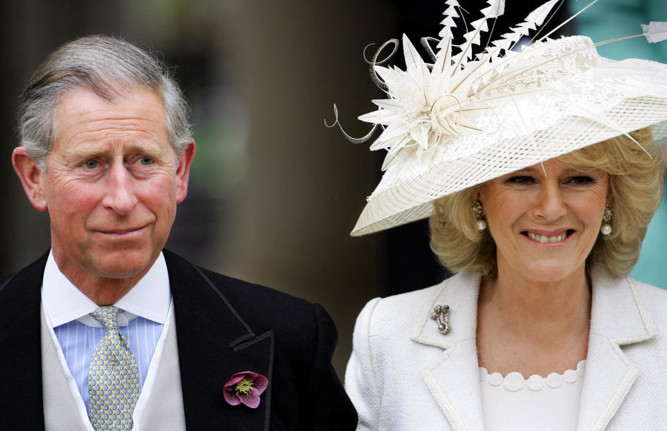 TOPSHOT - Prince Charles and the Duchess of Cornwall, formerly Camilla Parker Bowles, leave the Guildhall in Windsor, England, where they were married in a private ceremony 09 April 2005. Prince Charles and his longtime sweetheart Camilla Parker Bowles married today after two months of muddled preparations and a lifetime of waiting. (Photo by Adrian DENNIS / AFP) (Photo by ADRIAN DENNIS/AFP via Getty Images)