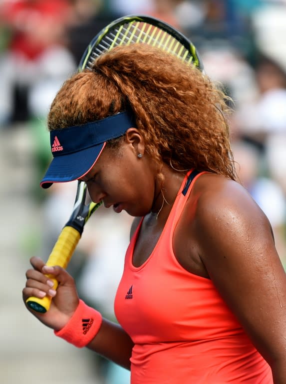 Naomi Osaka of Japan reacts after losing a point against Caroline Wozniacki of Denmark in the Pan Pacific Open in Tokyo on September 25, 2016