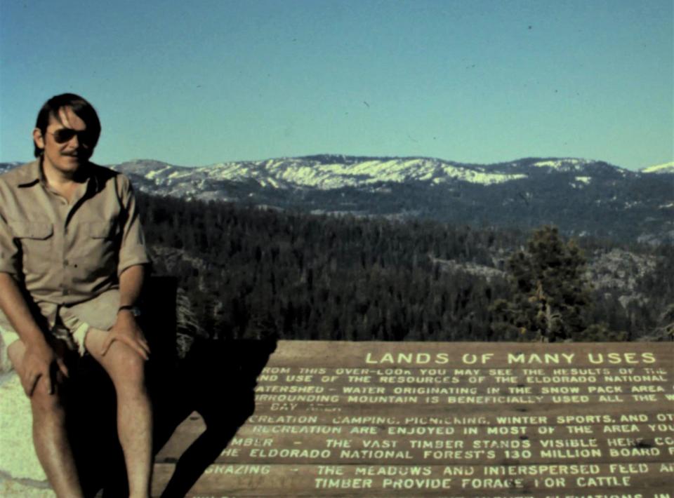 Carl LaVO near a roadwide marker below Donner Pass in the 1970s.