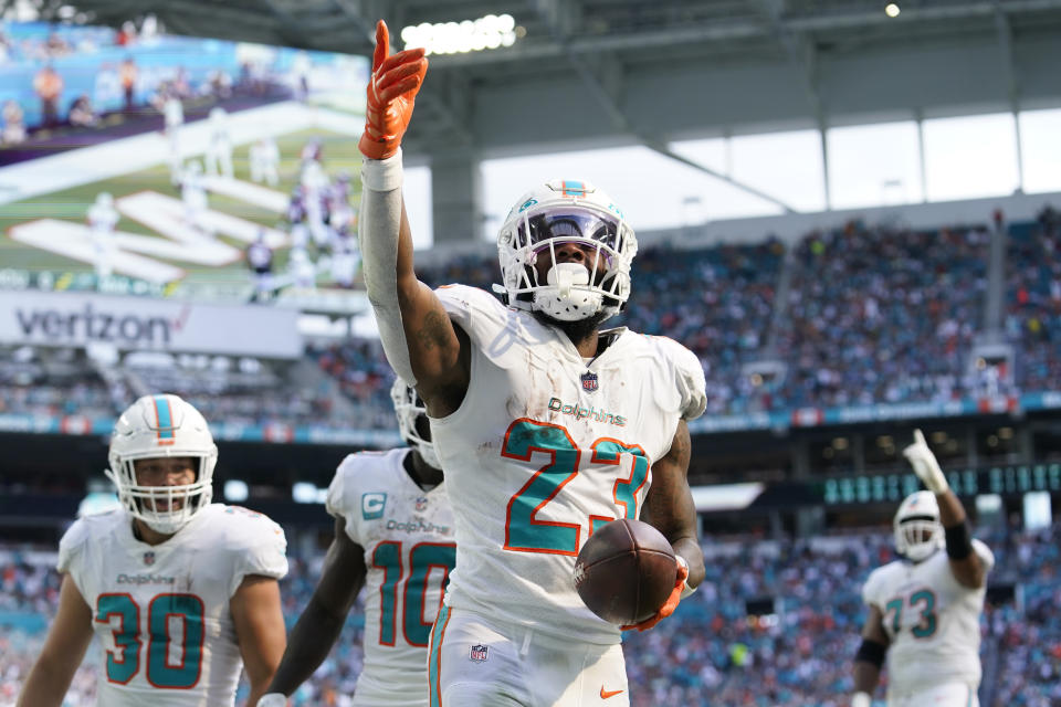 Miami Dolphins running back Jeff Wilson Jr. (23) celebrates his touchdown during the first half of an NFL football game against the Houston Texans, Sunday, Nov. 27, 2022, in Miami Gardens, Fla. (AP Photo/Lynne Sladky)