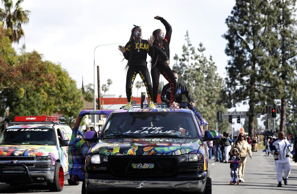 Parade participants with the League of Clowns in the 38th Annual Kingdom Day Parade in Leimert Park.