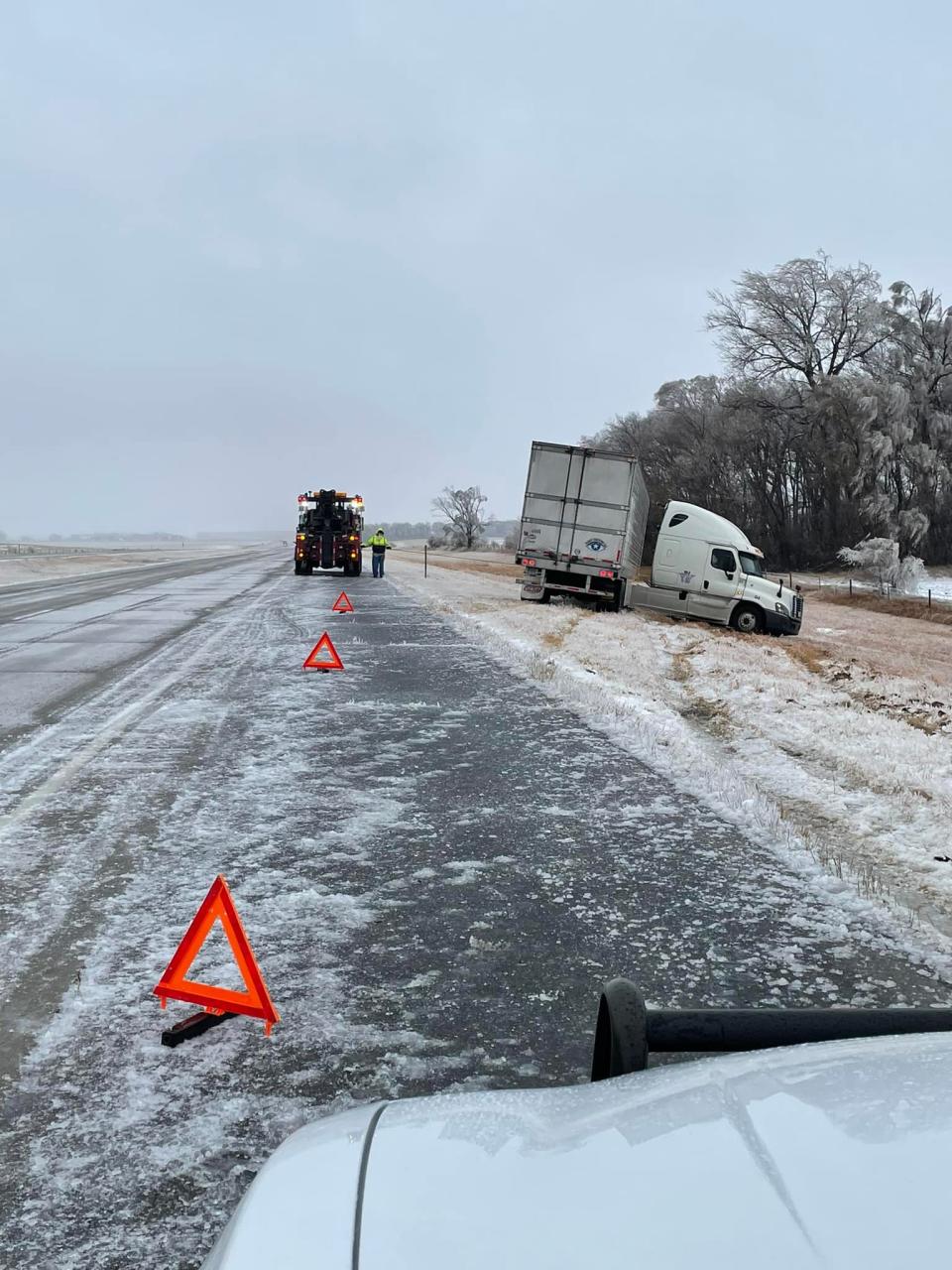 Several counties have no travel advisories across the state. State troopers assist a jackknifed semi that slid off I29 between Watertown and Brookings on Tuesday.