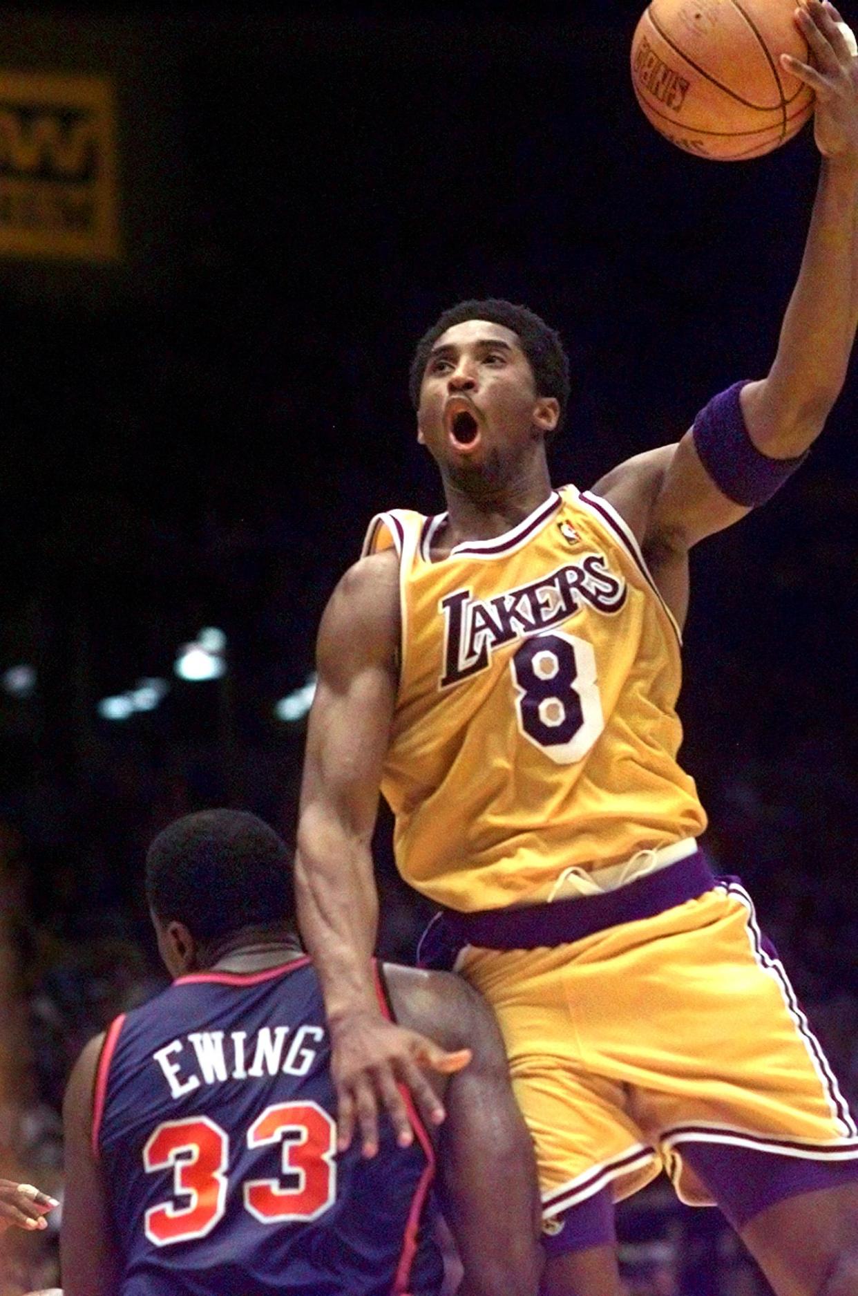 Los Angeles Lakers' Kobe Bryant shoots over New York Knicks' Patrick Ewing during the first half of their game Sunday, March 28, 1999, in Inglewood, Calif. The Lakers won the game 99-91.