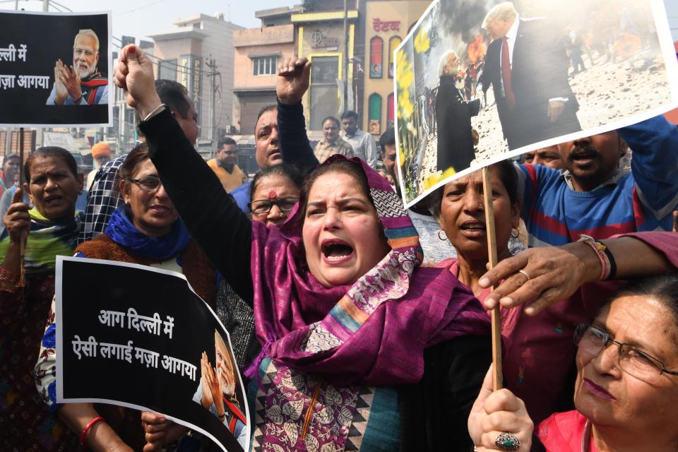 Congress Party workers shout slogans against Indian Prime Minister Narendra Modi during a protest in Amritsar on February 26, 2020, following clashes between people supporting and opposing a contentious amendment to India's citizenship law in New Delhi. - Riot police patrolled the streets of India's capital on Wednesday and the city's leader called for a curfew following battles between Hindus and Muslims that claimed at least 20 lives. The two days of unrest -- which has seen clashes between mobs armed with swords and guns -- is the worst sectarian violence seen in Delhi in decades. (Photo by NARINDER NANU / AFP) (Photo by NARINDER NANU/AFP via Getty Images)