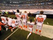 Sep 24, 2017; Indianapolis, IN, USA; The Cleveland Browns team stand and kneel during the National Anthem before the start of their game against the Indianapolis Colts at Lucas Oil Stadium. Mandatory Credit: Thomas J. Russo-USA TODAY Sports