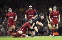 Wales' Alun Wyn Jones tackles New Zealand's Beauden Barrett during their Autumn International rugby union match at the Millennium Stadium in Cardiff, Wales, November 22, 2014. REUTERS/Rebecca Naden